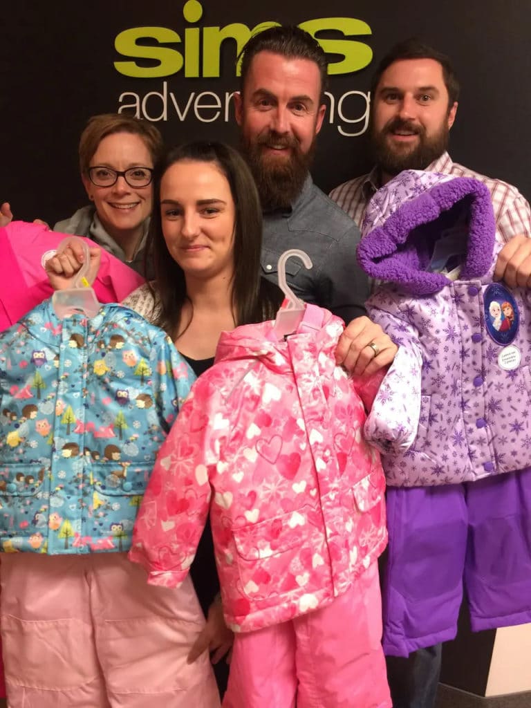 The Sims team collecting snowsuits for Children's Aid Society of Hamilton