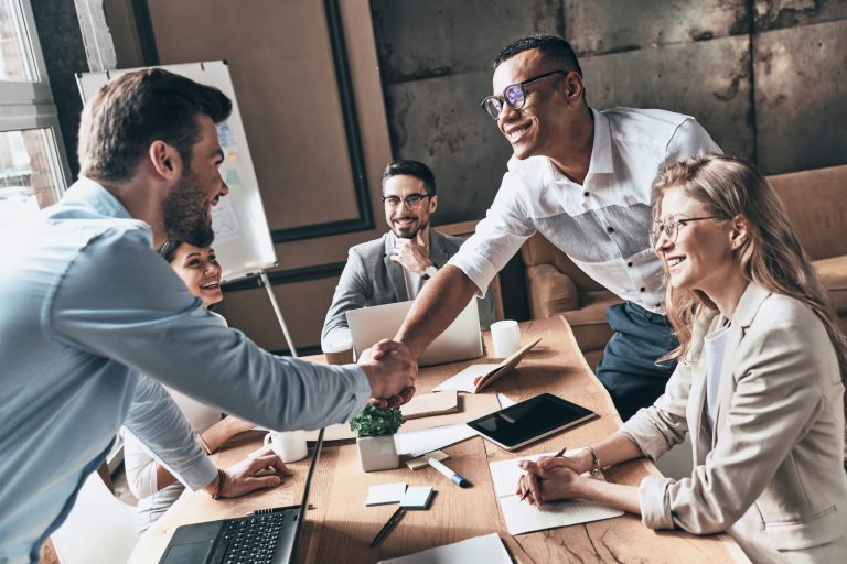 marketing team shaking hands